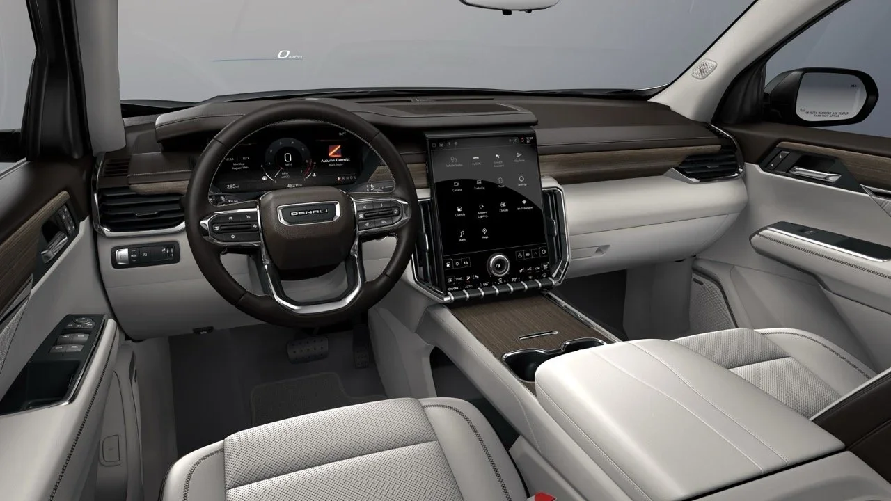 GMC Acadia Denali interior with vertical touchscreen, wood trim and light leather seats