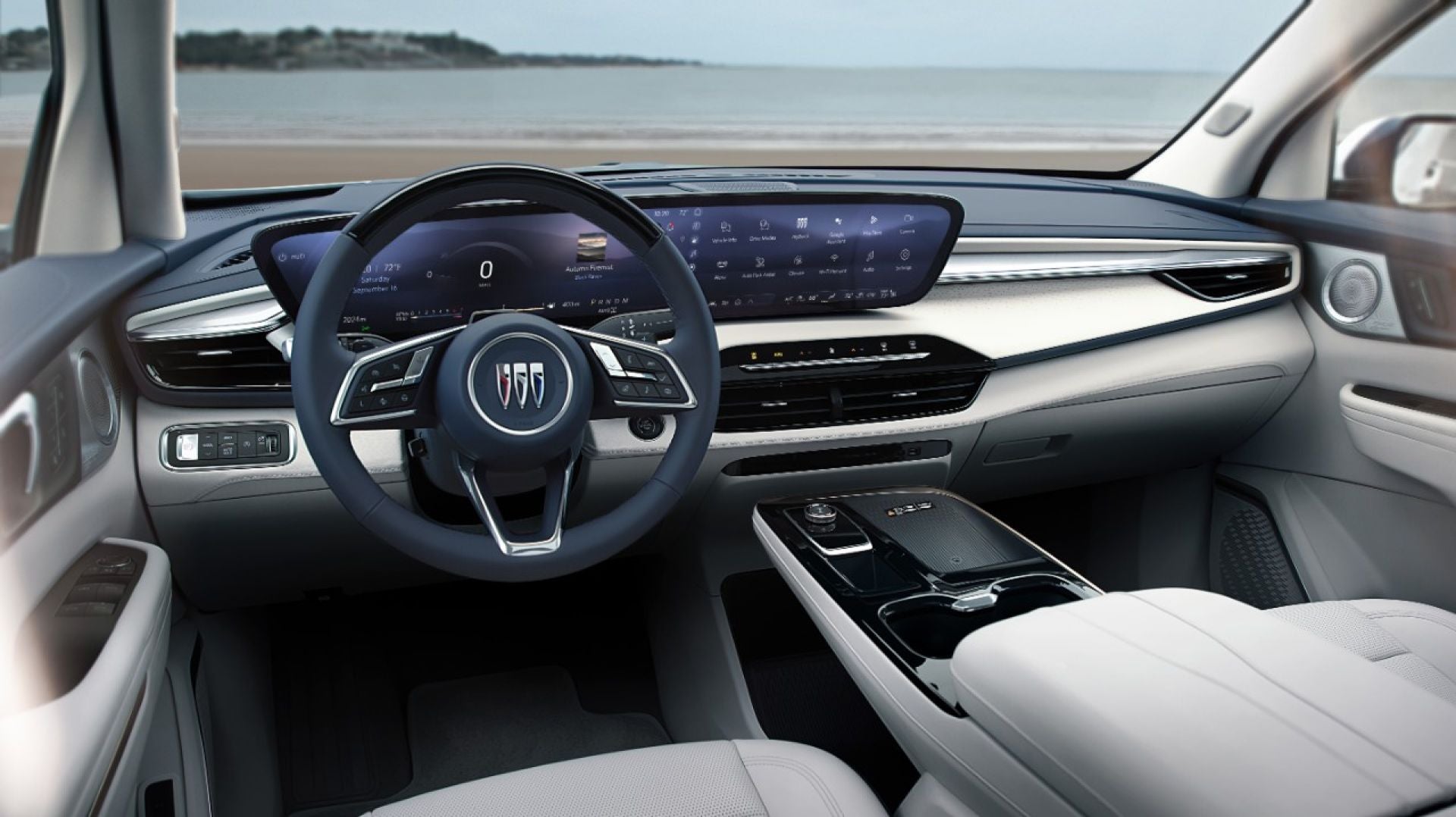Buick Enclave Avenir cabin with steering wheel and wide curved display