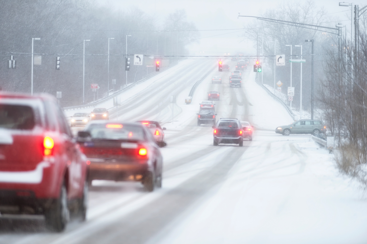 Cars driving during a Minnesota winter snowstorm