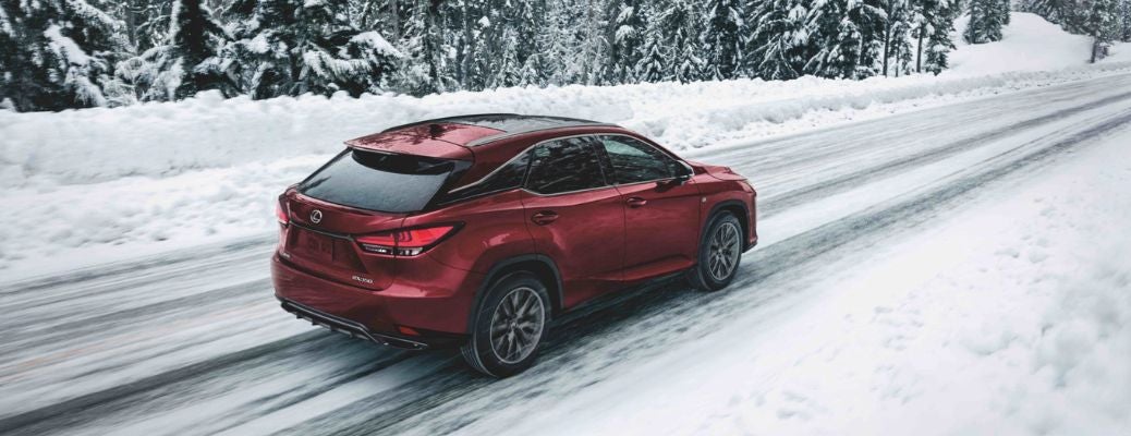 a 2022 Lexus RX cruising through a snowy road.