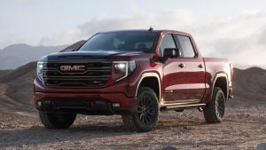 The 2025 GMC Sierra parked on an off road work site.