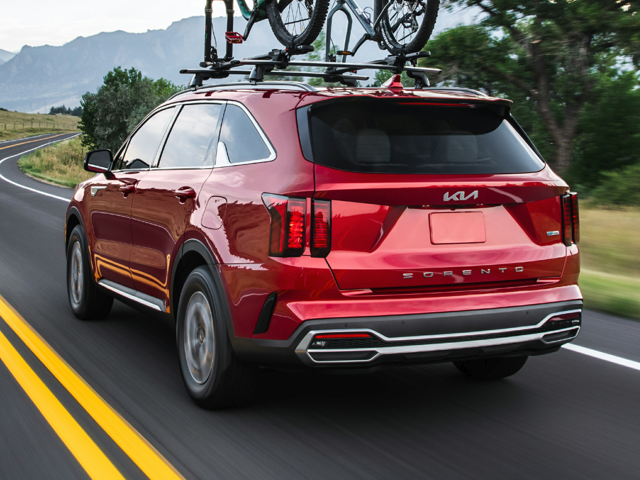 Red 2024 Kia Sorento being driven on the road. | Kia dealer in Altoona, PA | Altoona Courtesy Kia
