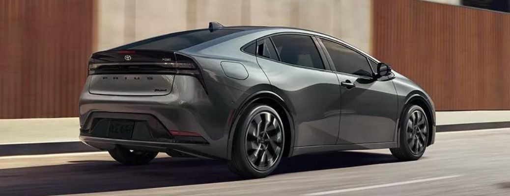 Back view of a 2023 Toyota Prius Prime during the day.