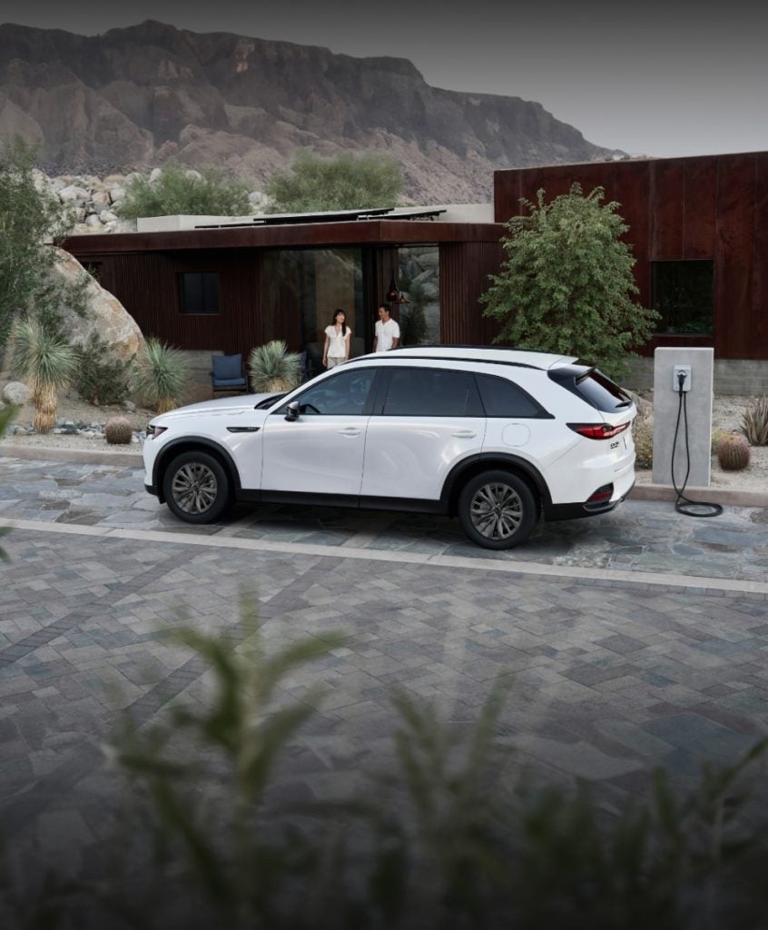Mazda CX-70 PHEV charging at a public charging station