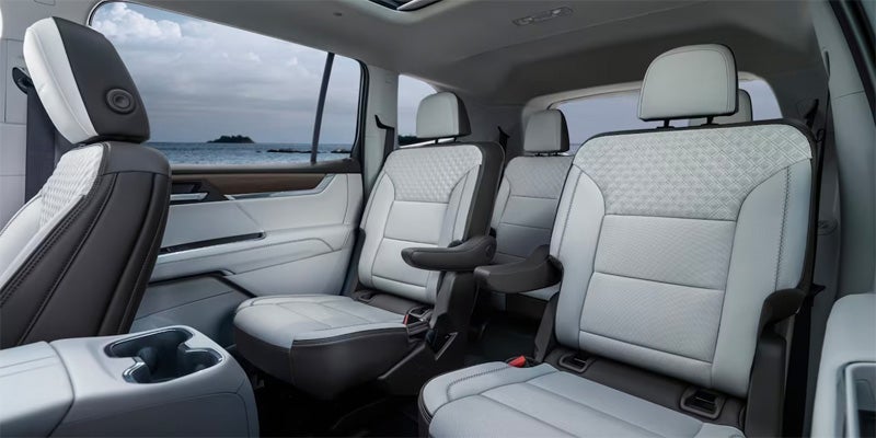 rear interior view of cream leather seats on a newly detailed GMC vehicle
