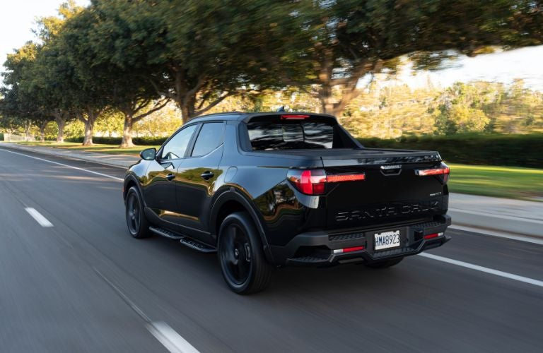 2023 Hyundai Santa Cruz Night on the road rear view