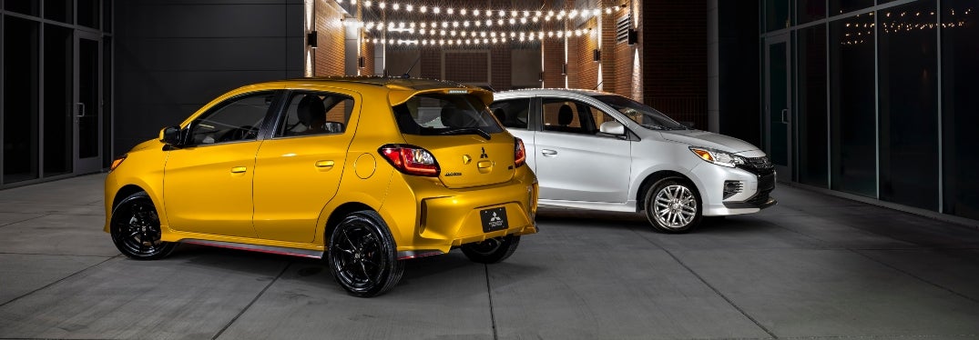 Yellow Mitsubishi Mirage and White Mirage G4 Parked