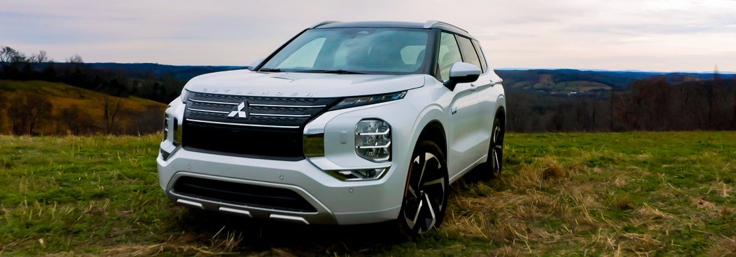 White 2023 Mitsubishi Outlander PHEV Parked in Field