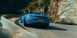 2024 Porsche 718 Cayman driving through the hills.