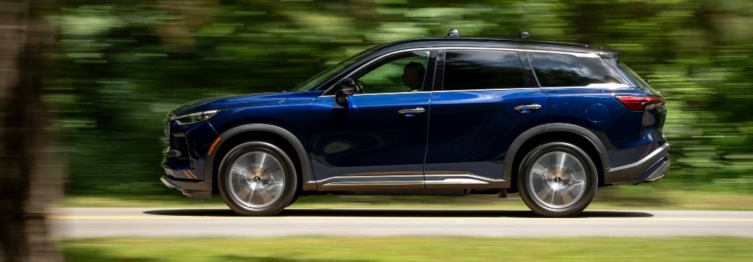 Blue 2024 INFINITI QX60 Driving in Motion