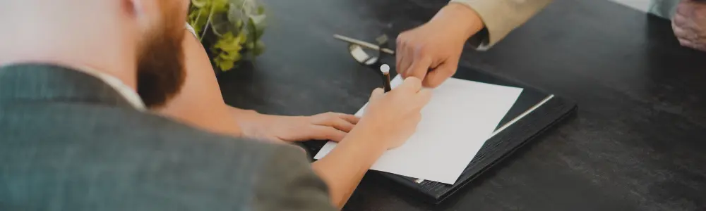 woman signing document