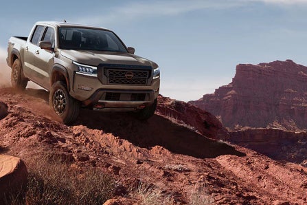 Nissan Frontier 4x4 driving on rocky road
