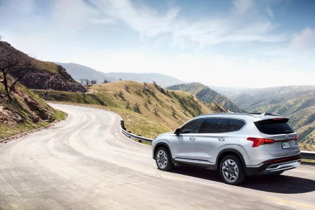 Hyundai Santa Fe PHEV Driving Around Curve on Mountain