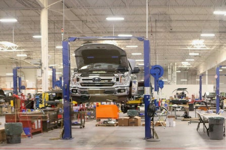 Car on a Lift in an Auto Shop