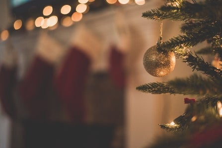 Gold Ornament Hanging in Christmas Tree
