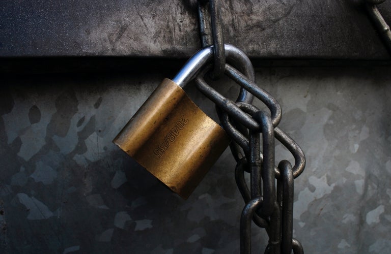 Gold padlock on chain
