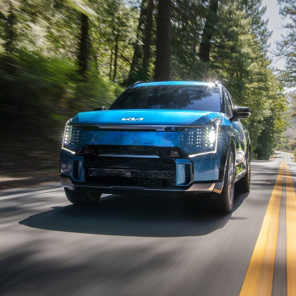 A 2024 Kia EV9 driving down a road near Hayward, CA