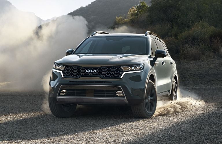A 2023 Kia Sorento on a sandy terrain
