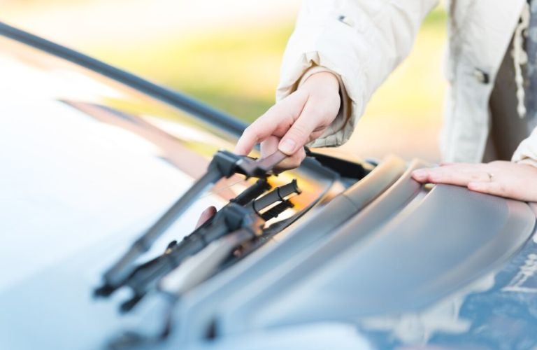 Technician adjusting windshield wiper