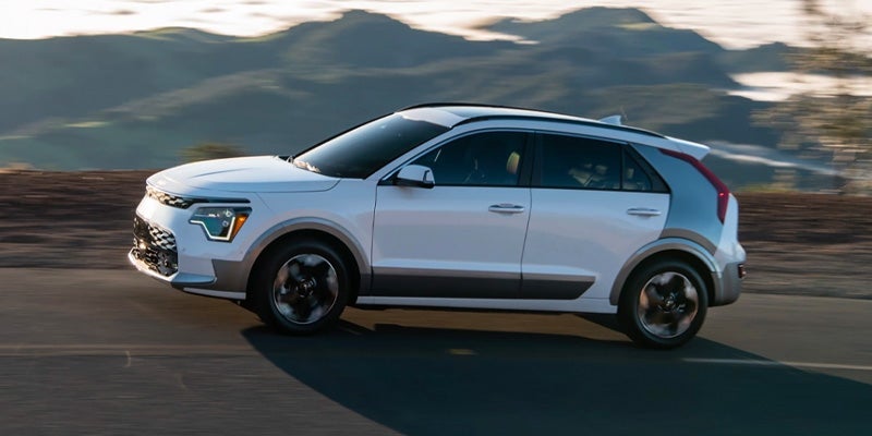 A 2024 Kia Niro EV driving down the highway near Hayward, CA