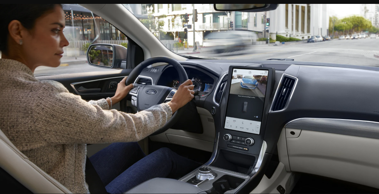 Woman driving a Ford Edge