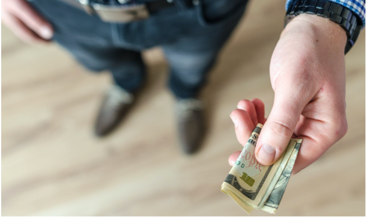 Person giving money