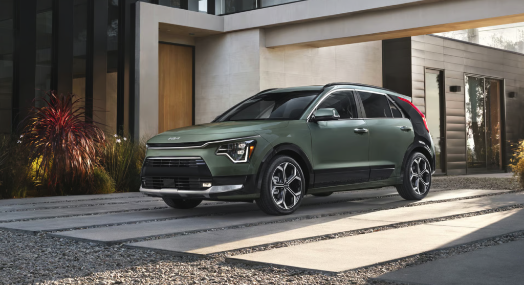 2026 Kia Niro Hybrid exterior parked near a modern building