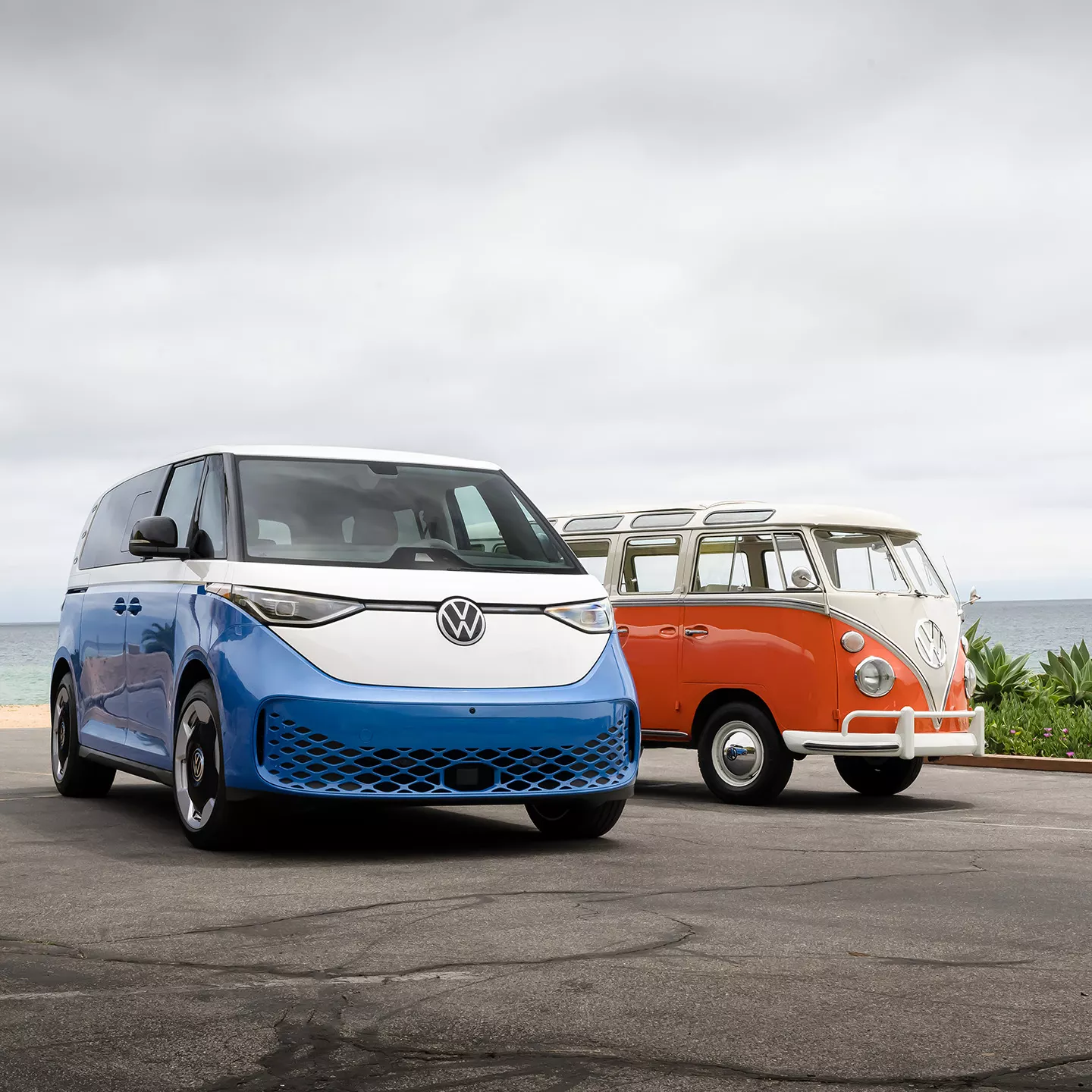 Volkswagen ID. Buzz beside a classic VW bus showing modern electric van design