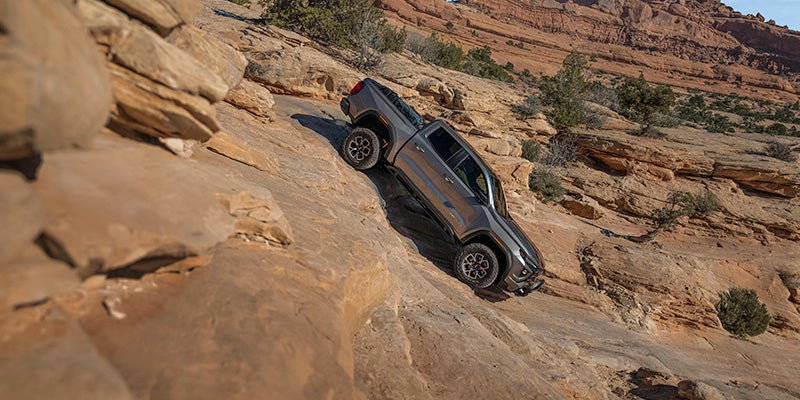GMC Canyon driving down rocky terrain