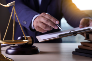 Lawyer filling out paperwork in his office