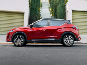 Red 2024 Nissan Kicks left hand side profile parked on the street | Vancouver, WA