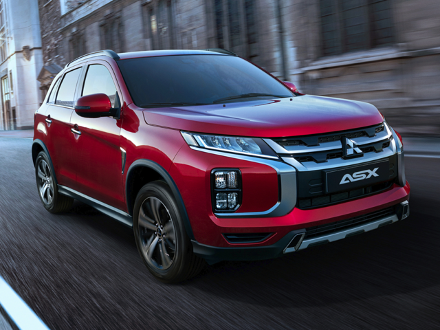 A red 2024 Mitsubishi Outlander Sport being driven on the road | Mitsubishi dealer in Hampton, VA | Banister Mitsubishi Hampton