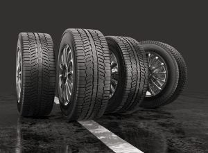 Four car tires rolling on a road on a gray background. 3d illustration | Vancouver, WA