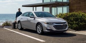 a silver 2024 Chevy Malibu Parked outside a modern home | Vancouver, WA