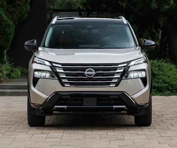2025-nissan-rogue-parked-driveway-front-view