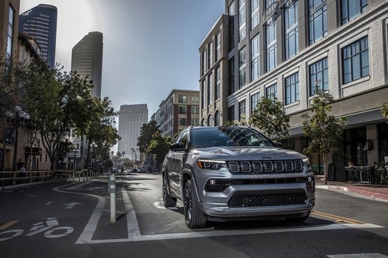 Jeep driving through a city