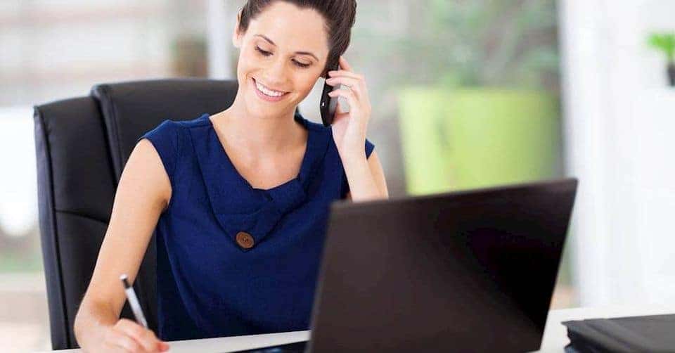happy woman on the phone with a customer