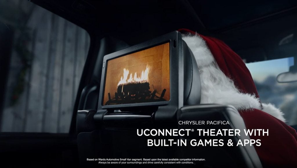 Showing the head rest screen on the back of the driver's seat in the Pacifica.