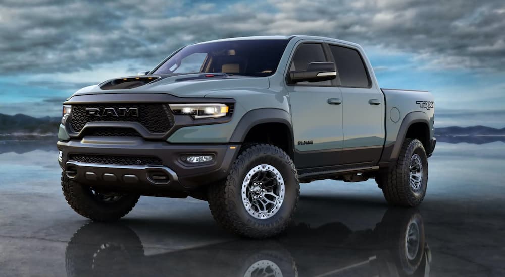 Blue-Green 2021 Ram 1500 TRX parked on a frozen lake.
