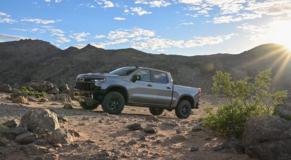 A grey 2024 Chevy Silverado 1500 ZR2 is shown from the side.