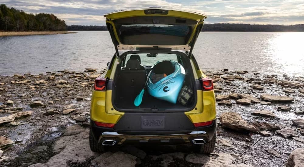 The cargo area of a yellow 2024 Chevy Trailblazer is shown.