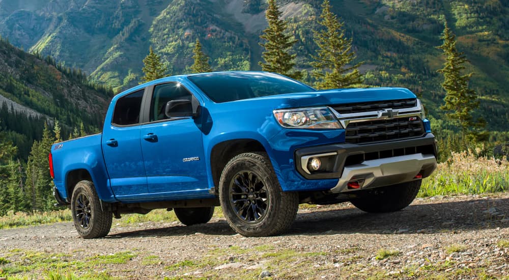 Blue 2022 Chevy Colorado Z71 driving on a dirt road.