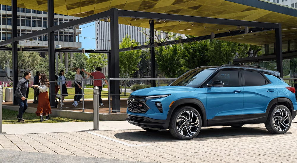 Blue 2026 Chevy Trailblazer parked near a park.