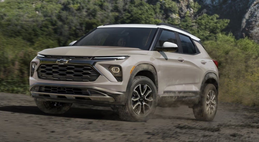 A tan 2026 Chevy Trailblazer Activ driving off-road.