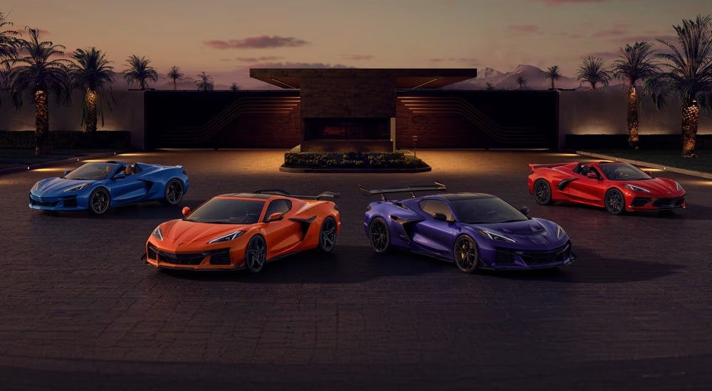 The 2025 Chevy Corvette family lineup parked at a Chevy dealer near Jackson.