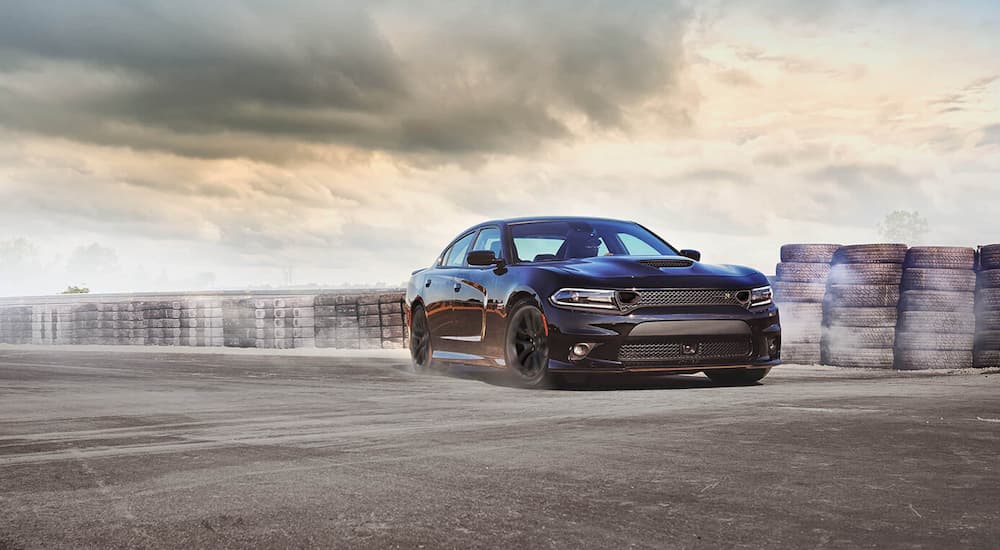 Purple 2021 Dodge Charger R/T driving on a track