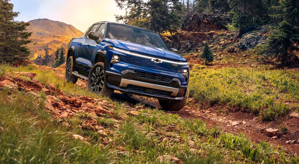 A blue 2025 Chevy Silverado EV RST is shown from the front after leaving a Chevy dealer near South Lyon.