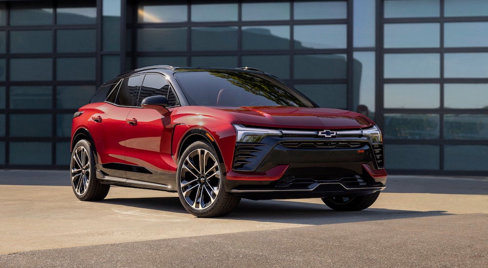 A red 2024 Chevy Blazer EV SS parked outside a building and angled right.