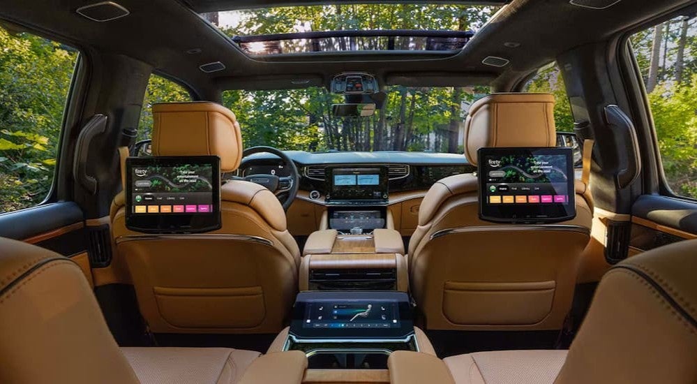 Tan interior, black dash, and infotainment displays in a 2027 Jeep Grand Wagoneer.
