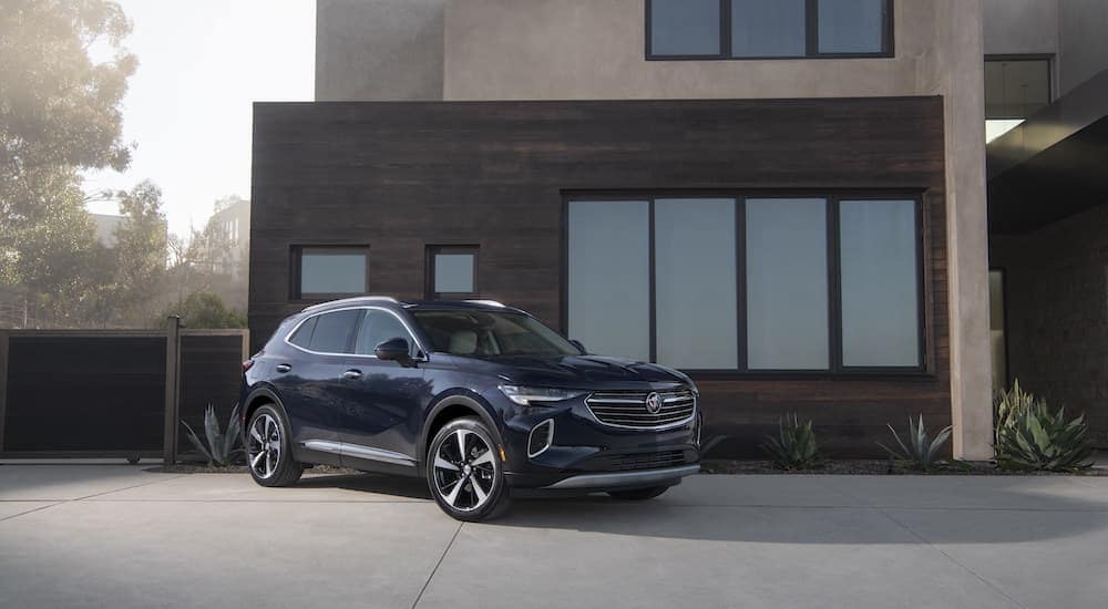 A blue 2023 Buick Enclave Avenir is shown from the front at an angle.
